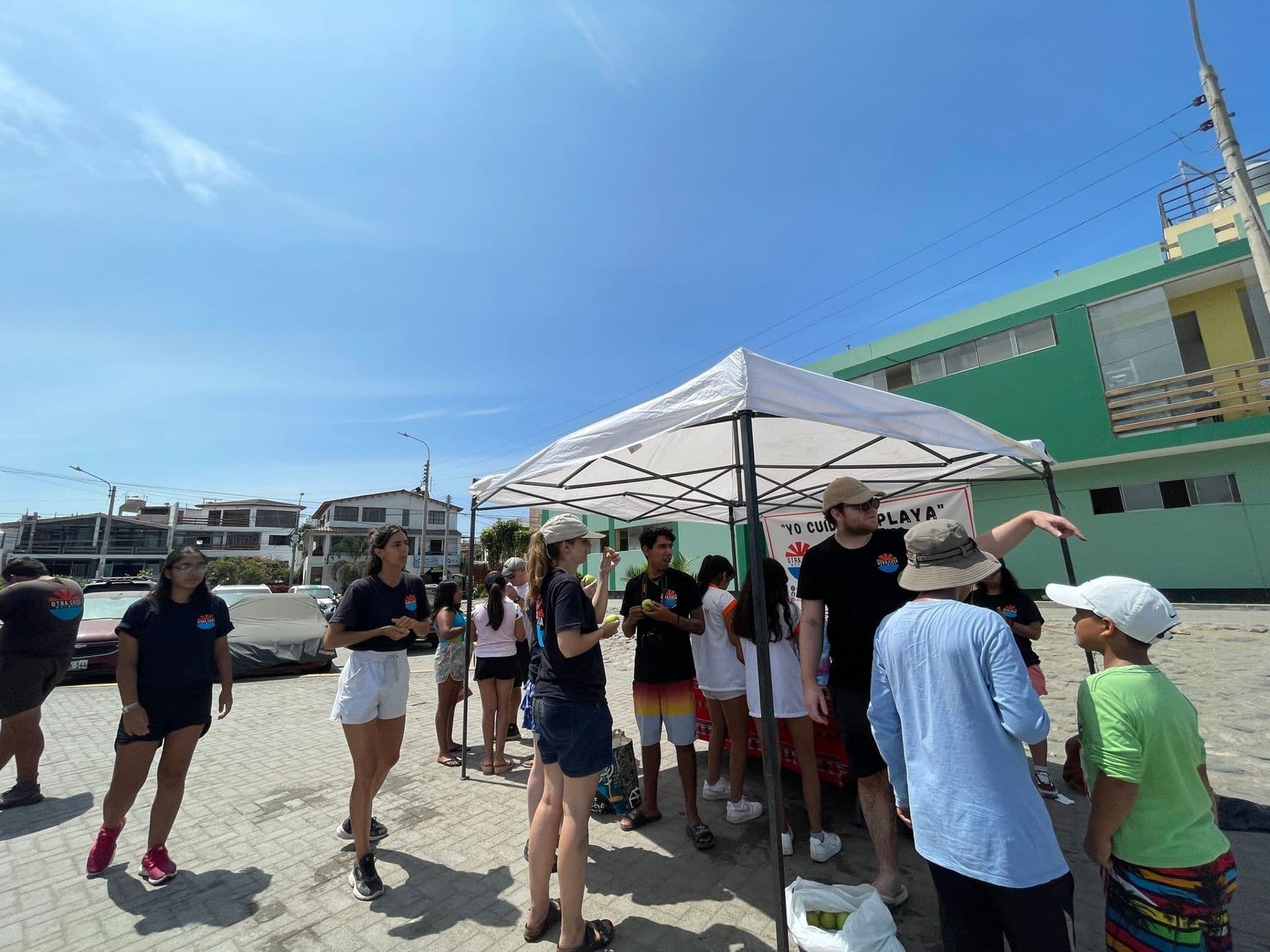 Volunteers chatting with local people at an outdoor community event
